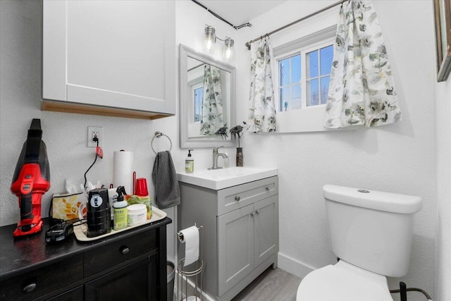 24894 Long St, Fall River Mills, CA 96028 - bathroom with vanity, toilet, and wood finished floors
