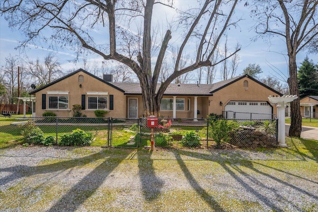 6040 Hornbeck Ln, Anderson, CA 96007 - ranch-style house with a fenced front yard, a chimney, driveway, and stucco siding