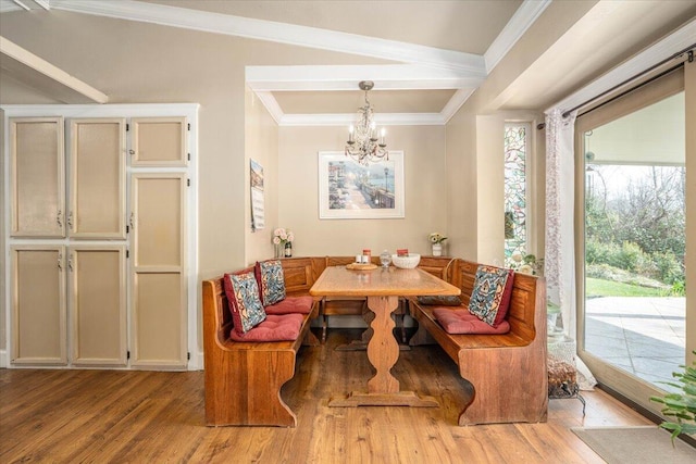 6040 Hornbeck Ln, Anderson, CA 96007 - dining space with crown molding, wood finished floors, a chandelier, and breakfast area