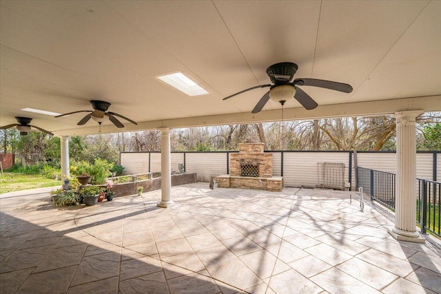 6040 Hornbeck Ln, Anderson, CA 96007 - view of patio with an outdoor stone fireplace and ceiling fan