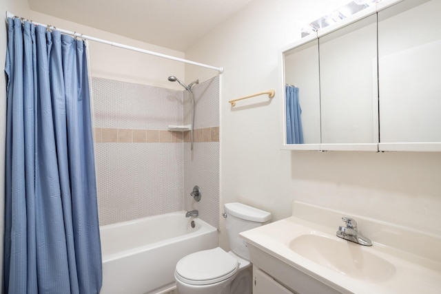 full bathroom with vanity, shower / bath combination with curtain, and toilet