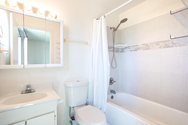 full bathroom with vanity, toilet, and shower / bathtub combination with curtain