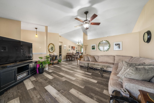 living area featuring vaulted ceiling, ceiling fan with notable chandelier, and dark wood-style flooring