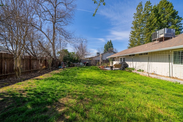 view of yard with a fenced backyard