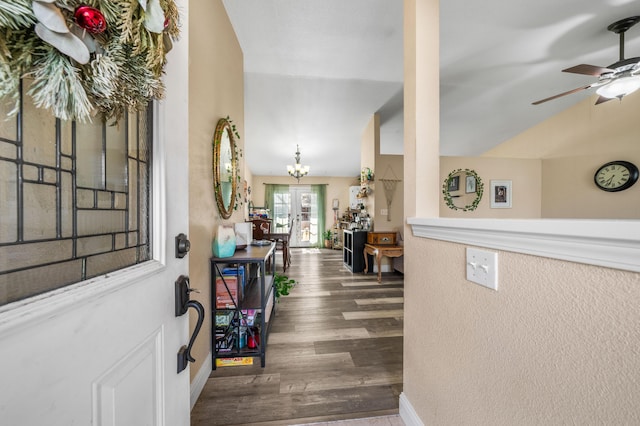 entrance foyer with ceiling fan, baseboards, lofted ceiling, and wood finished floors