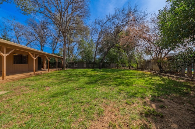 view of yard featuring a patio area and a fenced backyard