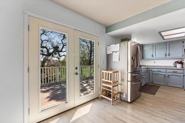 entryway with french doors and light wood finished floors