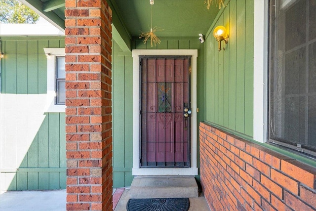 entrance to property with brick siding