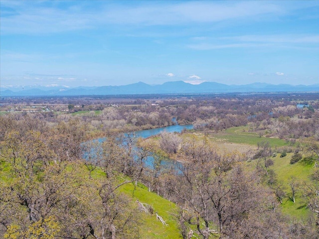 mountain view with a water view and a wooded view