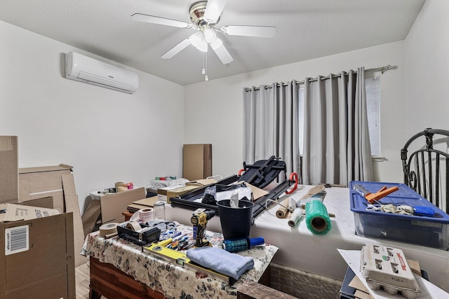 bedroom with ceiling fan and a wall mounted AC