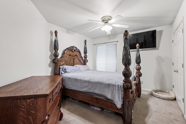 carpeted bedroom with a ceiling fan