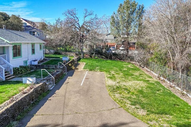 view of yard featuring a garden and fence