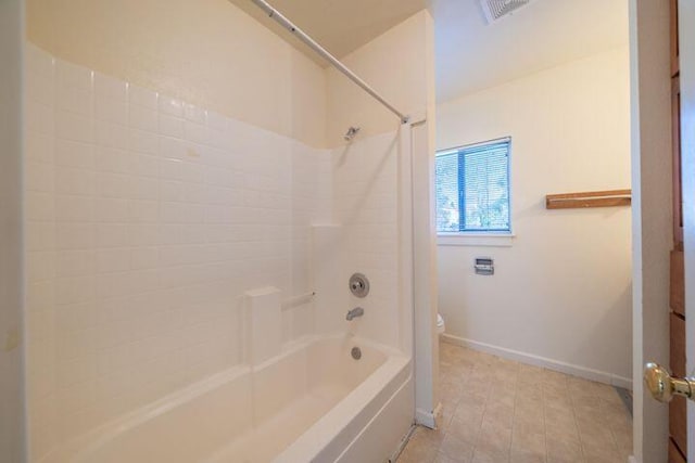 bathroom with visible vents, baseboards, toilet, and bathing tub / shower combination
