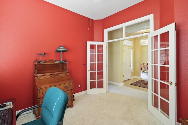 office area with french doors, baseboards, and carpet