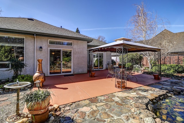 view of patio / terrace with a gazebo and fence