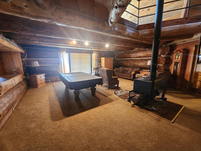 playroom featuring billiards, carpet, log walls, beam ceiling, and a wood stove