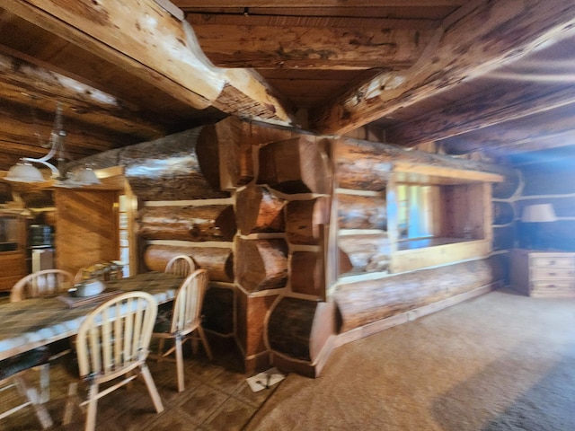 wine room with log walls and carpet