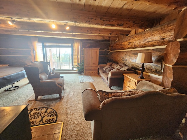 carpeted living room featuring rustic walls, beamed ceiling, wooden ceiling, and rail lighting