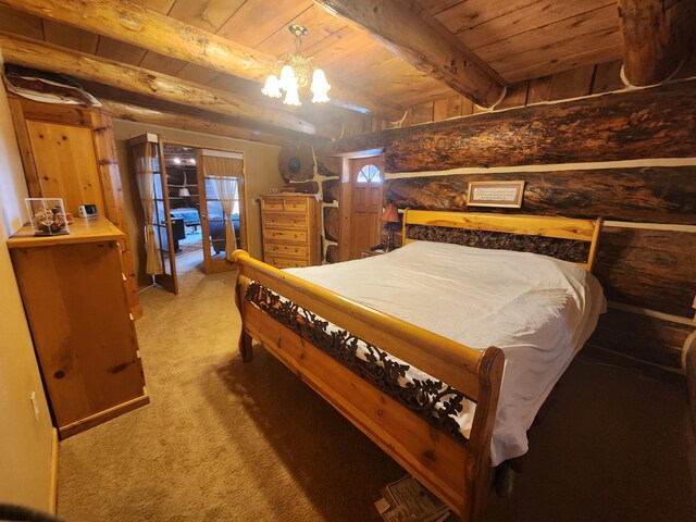 bedroom with beam ceiling, light carpet, wooden walls, an inviting chandelier, and wooden ceiling