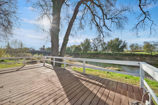 wooden terrace with a water view