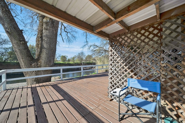 wooden deck featuring a water view