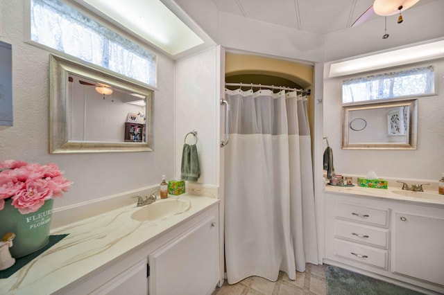 full bathroom with vanity and curtained shower