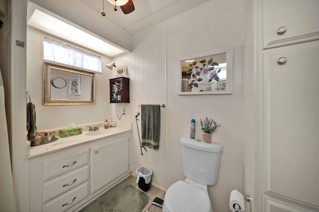 bathroom featuring vanity, toilet, and ceiling fan