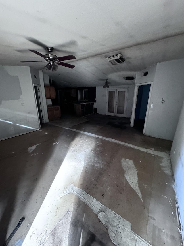 garage featuring visible vents, french doors, and a ceiling fan