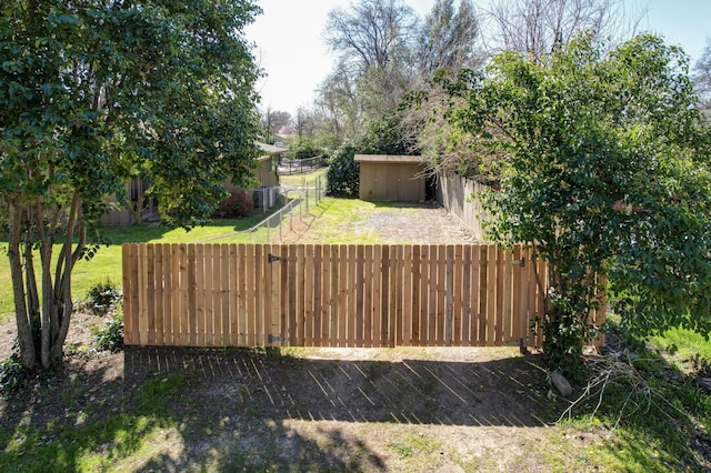 view of yard with an outdoor structure and fence