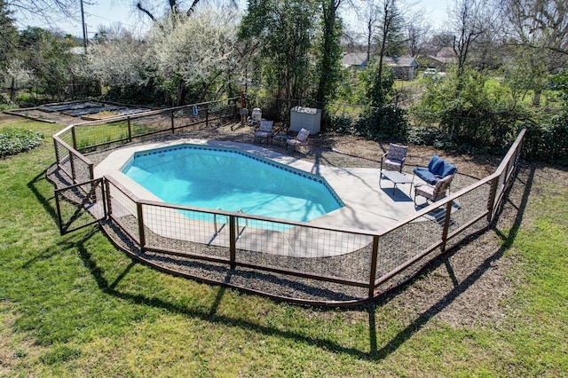 view of swimming pool with a lawn, a patio, a fenced backyard, and a fenced in pool