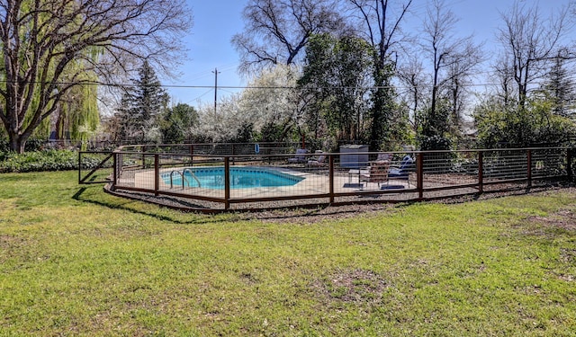 view of pool featuring a fenced in pool, a yard, and fence