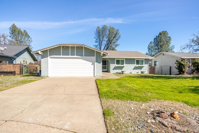 single story home with driveway, a front lawn, a garage, and fence