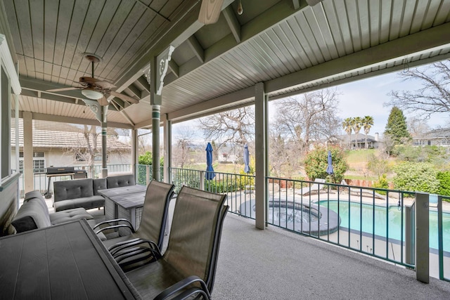 view of patio featuring outdoor lounge area, a pool with connected hot tub, and ceiling fan