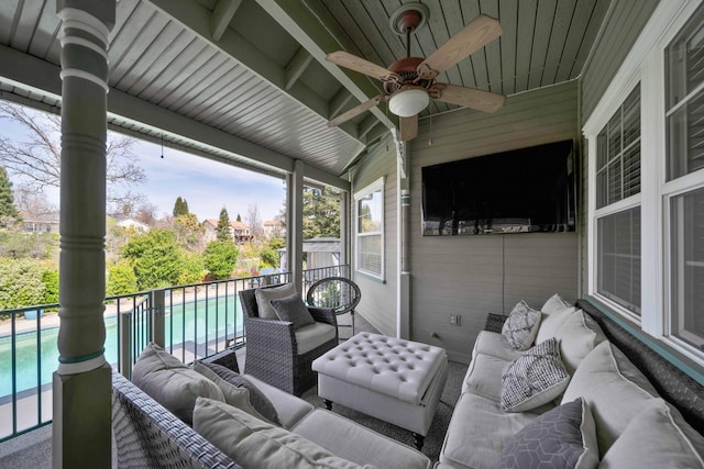 view of patio / terrace with outdoor lounge area, an outdoor pool, and ceiling fan