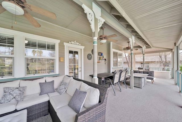 view of patio with an outdoor living space and a ceiling fan