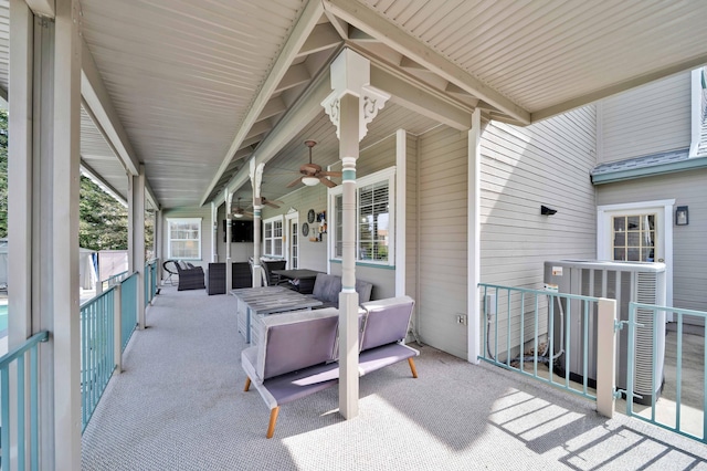 view of patio with central AC unit and a ceiling fan