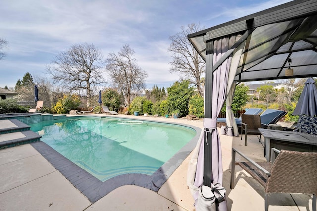 pool with a patio area