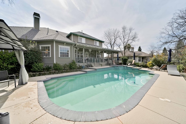 pool featuring a patio area