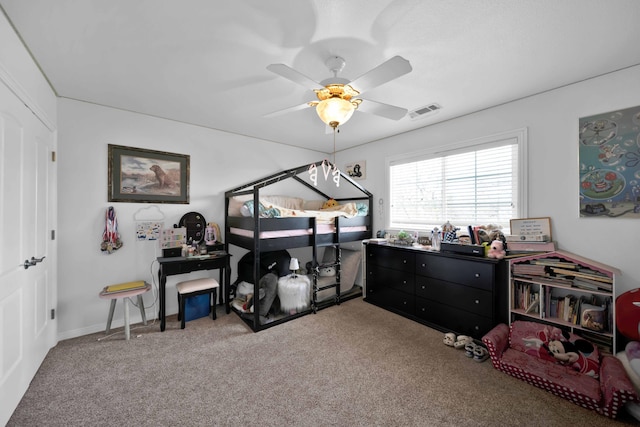 carpeted bedroom with a ceiling fan and visible vents