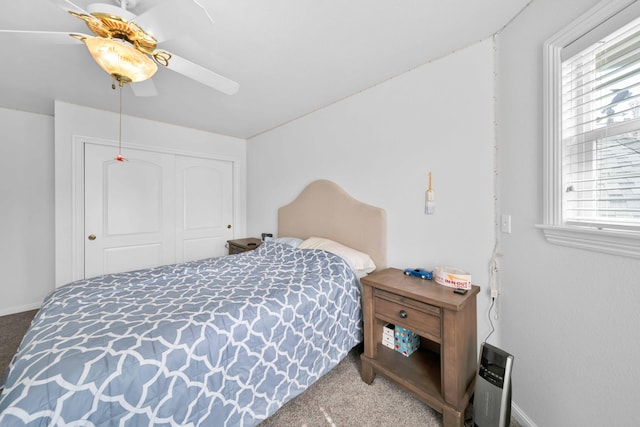 bedroom with baseboards, carpet, a closet, and ceiling fan