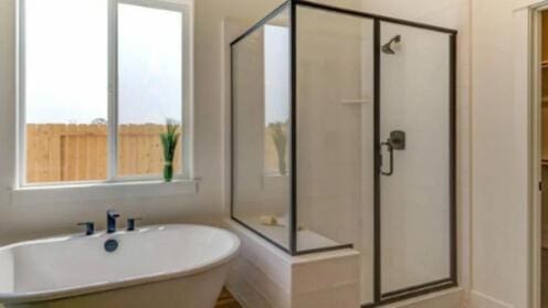 full bath with a freestanding bath and a stall shower