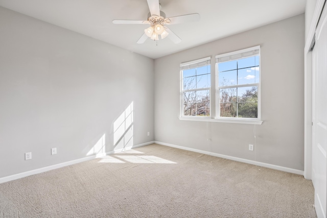 unfurnished bedroom featuring carpet flooring, ceiling fan, and baseboards