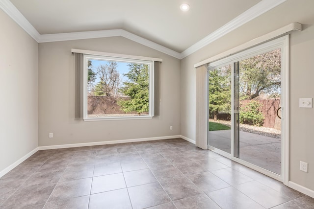 tiled spare room featuring lofted ceiling, crown molding, and baseboards