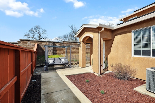 view of yard with central air condition unit, a patio area, and a fenced backyard