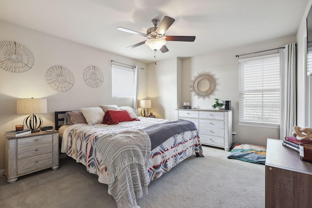 carpeted bedroom featuring a ceiling fan