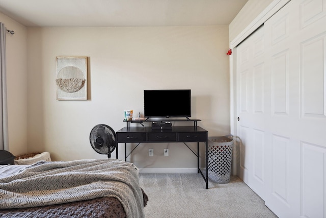 bedroom featuring carpet flooring and baseboards