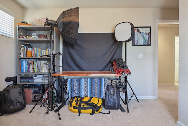 carpeted bedroom featuring baseboards