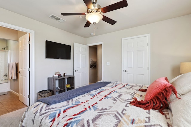 tiled bedroom featuring a ceiling fan and visible vents