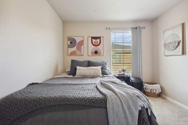 carpeted bedroom with baseboards