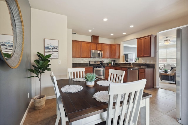 dining space featuring ceiling fan, baseboards, light tile patterned flooring, and recessed lighting